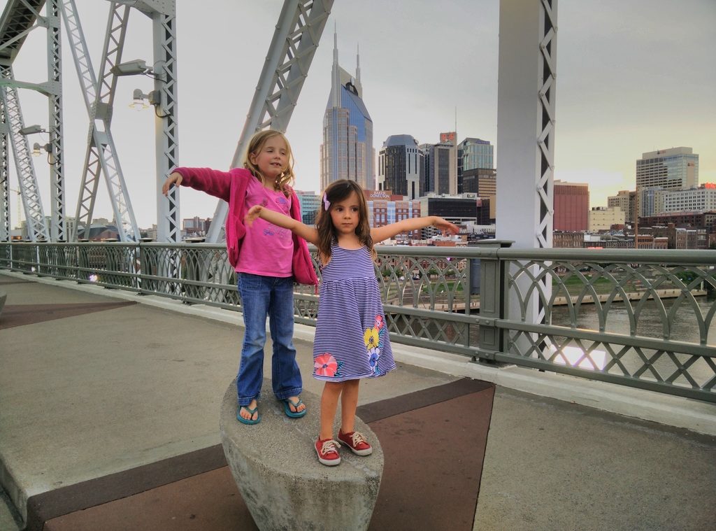 Walking over the pedestrian bridge.